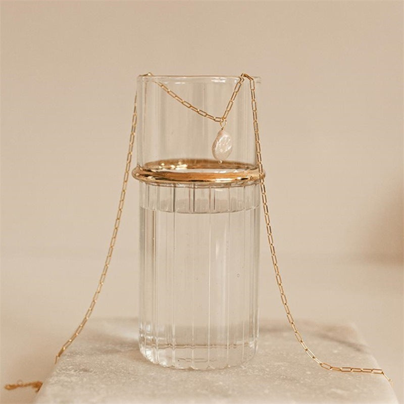 Collar de clip con moneda y perla