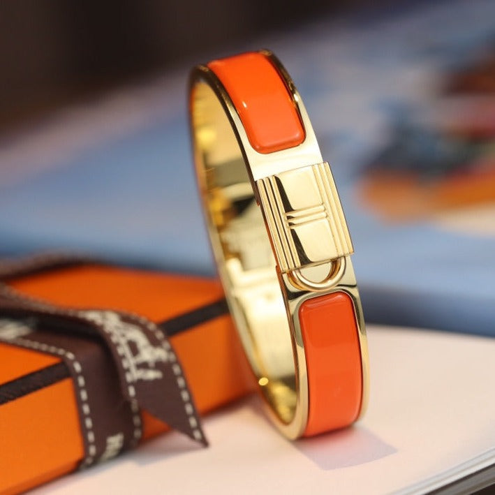 Pulsera dorada con candado naranja Helene
