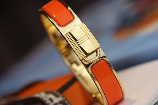 Pulsera dorada con candado naranja Helene